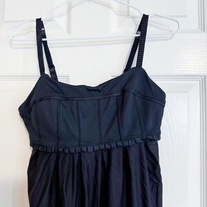 107- Lululemon Black Pritti Ruffle Tank Top With Adjustable Elastic Hem Size 6